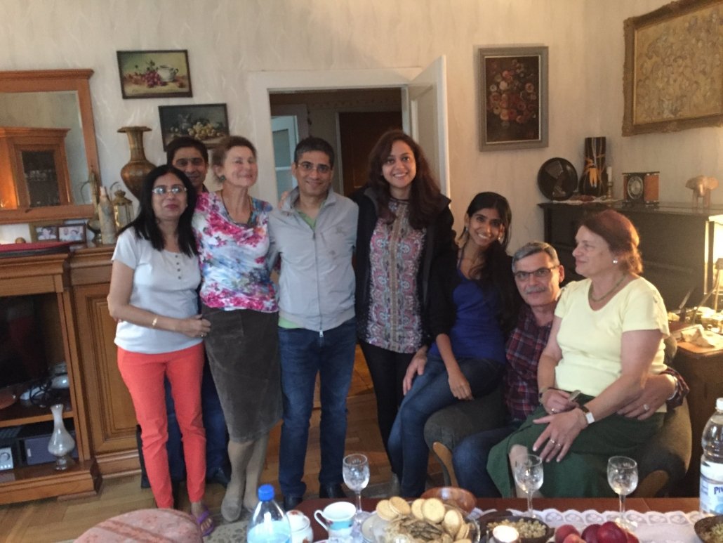 Kunwer Sachdev with family and friends around a table — the opposite of the alien-in-the-room feeling